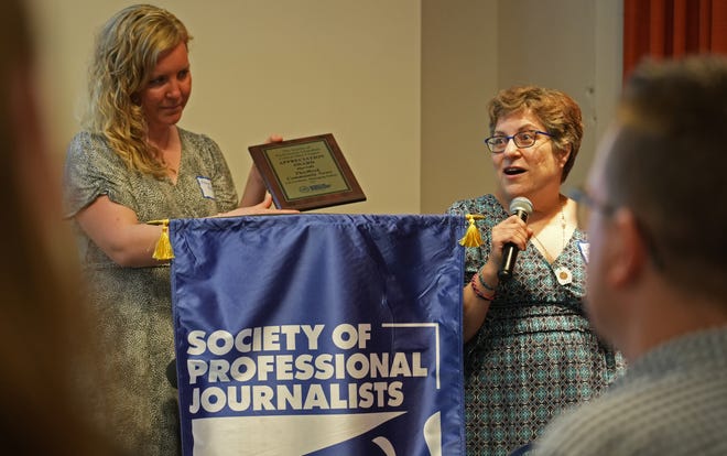 April 17, 2024; Columbus, Ohio, USA; Long-time Columbus Dispatch librarian and researcher Linda Deitch speaks during an appreciation award presentation at the 2024 Society of Professional Journalists Central Ohio Chapter annual Founders Day ceremony. At left is Eleanor Kennedy. In addition to an individual award for her years of service at the Dispatch, Deitch accepted an appreciation award on behalf of This Week Community News editor Lee Cochran. The event was held at the Columbus Center for Architecture and Design, 50 W. Town St.