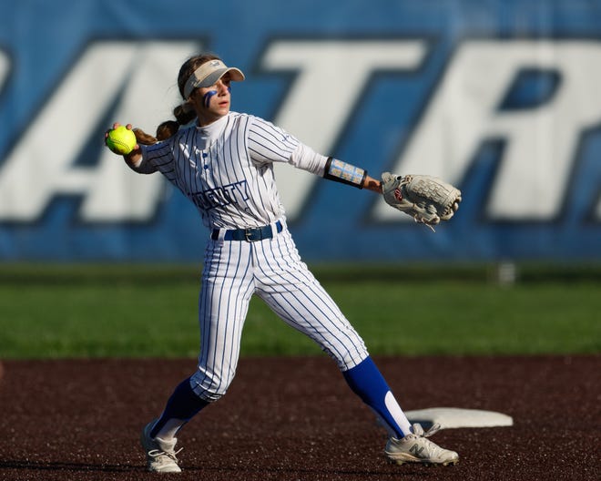 Apr 22, 2024; Powell, Ohio, USA; Olentangy Liberty's Izzy Matteo (4) throws to first during the high school softball game against Hilliard Bradley at Olentangy Liberty High School. Hilliard Bradley won 3-2. Mandatory Credit: Graham Stokes-The Columbus Dispatch