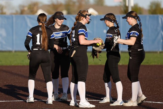 Apr 22, 2024; Powell, Ohio, USA; Hilliard Bradley players celebrate an out during the high school softball game at Olentangy Liberty High School. Hilliard Bradley won 3-2. Mandatory Credit: Graham Stokes-The Columbus Dispatch