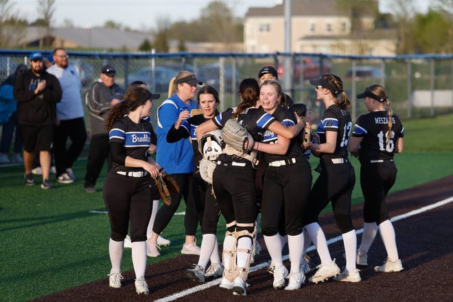 Apr 22, 2024; Powell, Ohio, USA; Hilliard Bradley pitcher Mickey Moody (32) hugs catcher Loghan Cromer (11) as the Jaguars celebrate their 3-2 win in a high school softball game at Olentangy Liberty High School. Mandatory Credit: Graham Stokes-The Columbus Dispatch